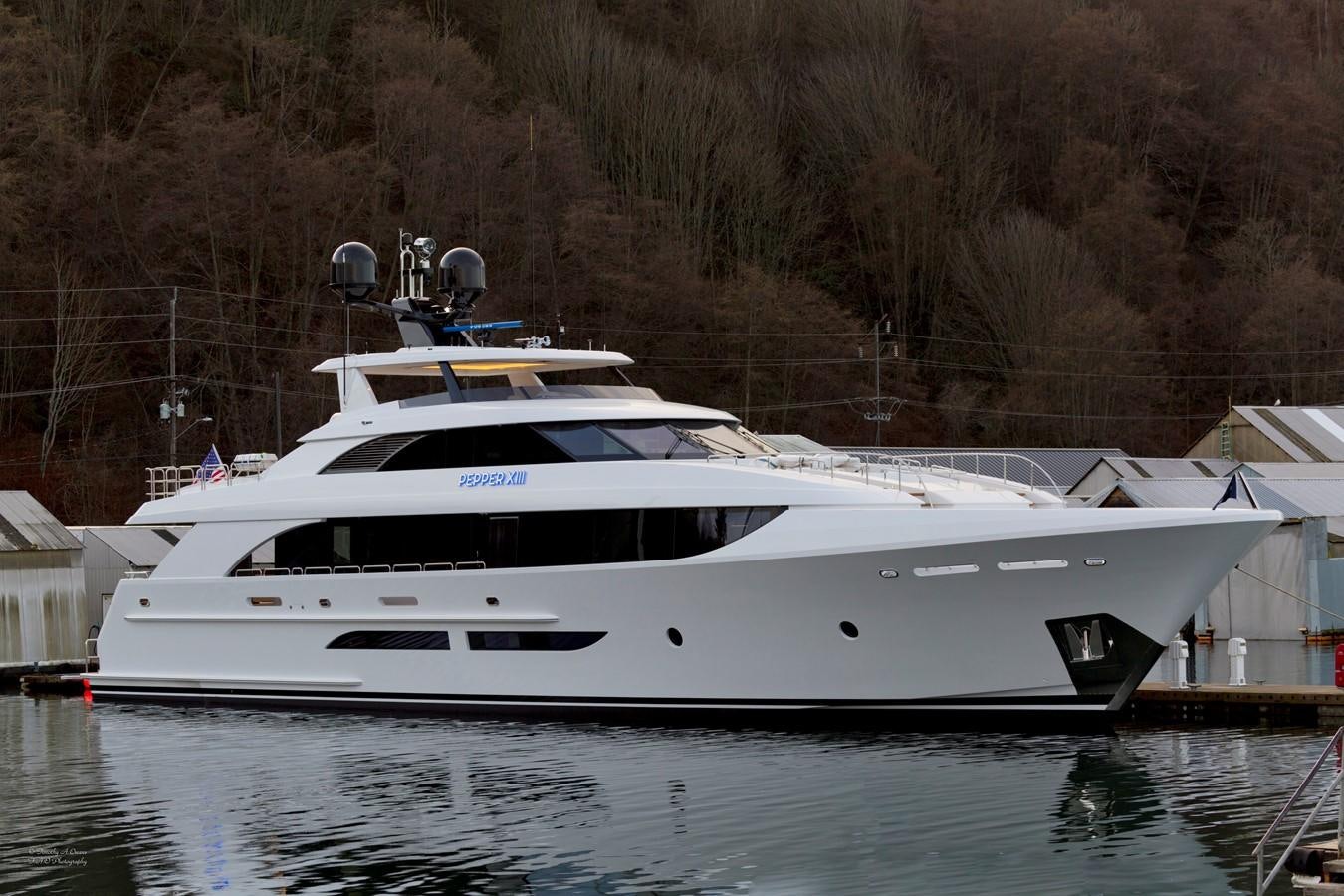 a white yacht docked aboard PEPPER XIII Yacht for Sale