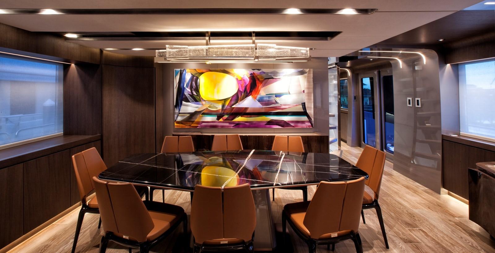 a room with a table and chairs aboard PEPPER XIII Yacht for Sale