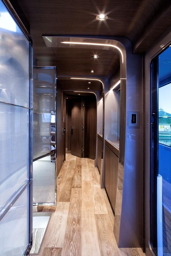a hallway with doors aboard PEPPER XIII Yacht for Sale