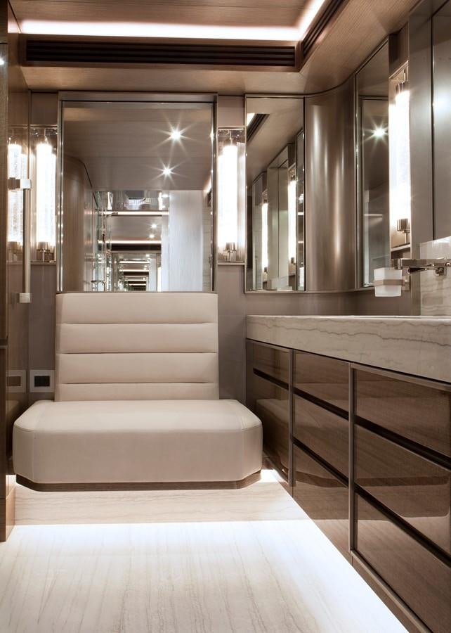 a room with a couch and a table aboard PEPPER XIII Yacht for Sale