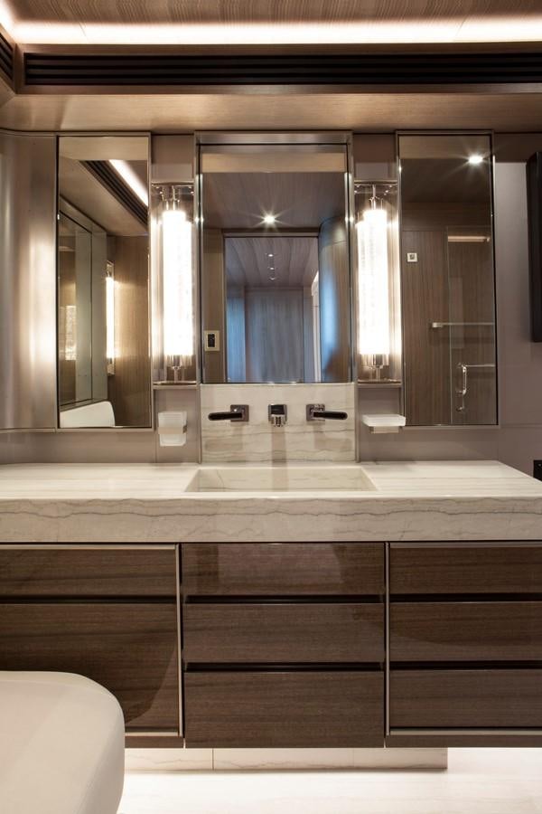 a bathroom with a large mirror aboard PEPPER XIII Yacht for Sale