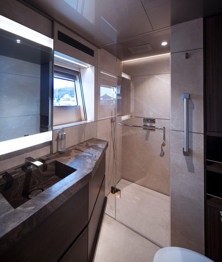 a bathroom with a sink and a mirror aboard PEPPER XIII Yacht for Sale
