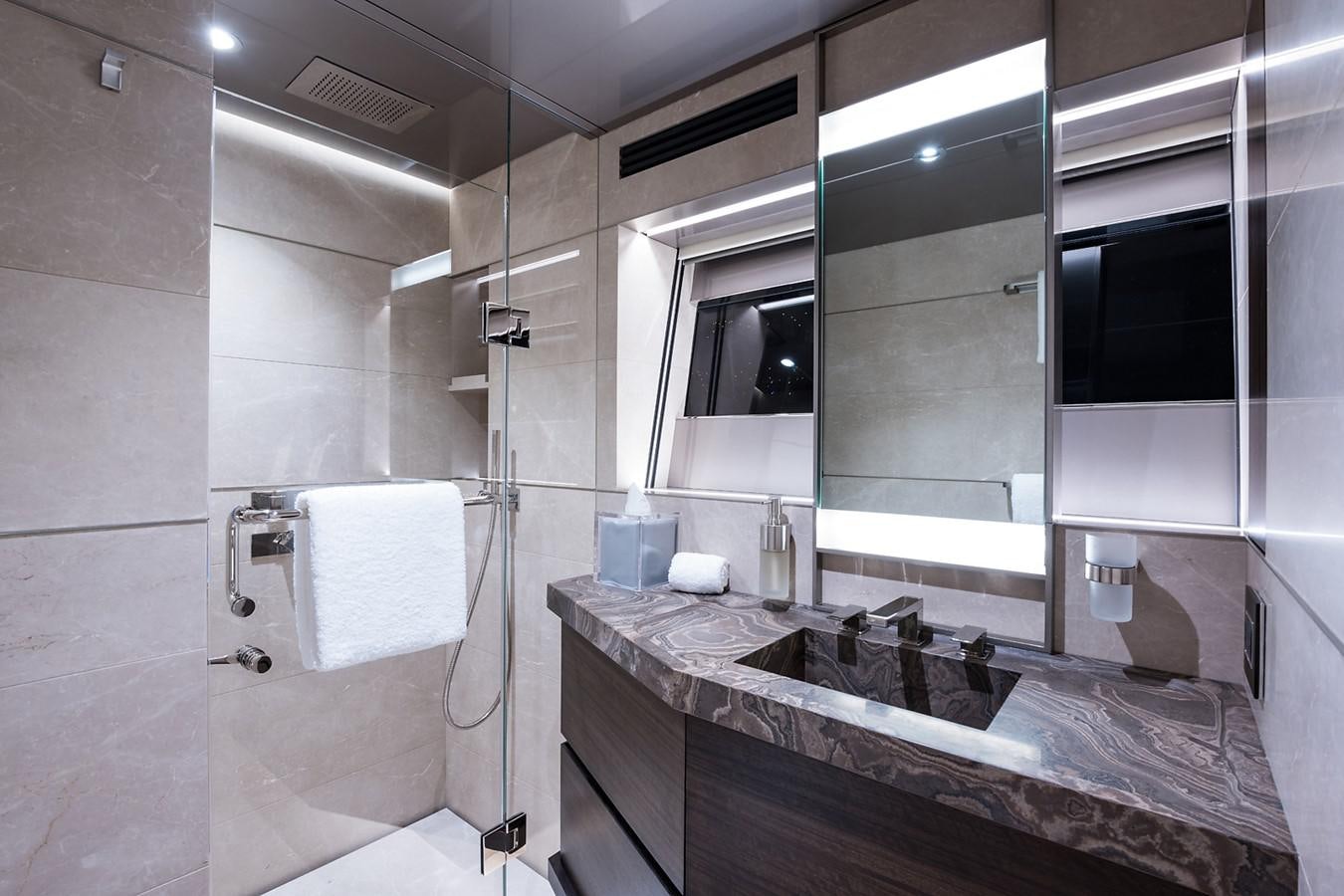 a bathroom with a sink and a mirror aboard PEPPER XIII Yacht for Sale