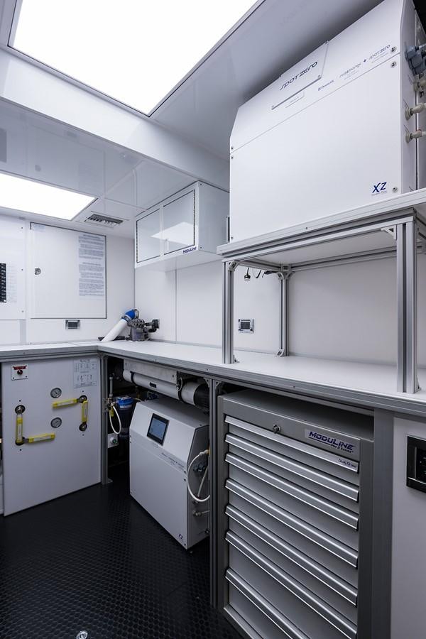 a kitchen with white cabinets aboard PEPPER XIII Yacht for Sale