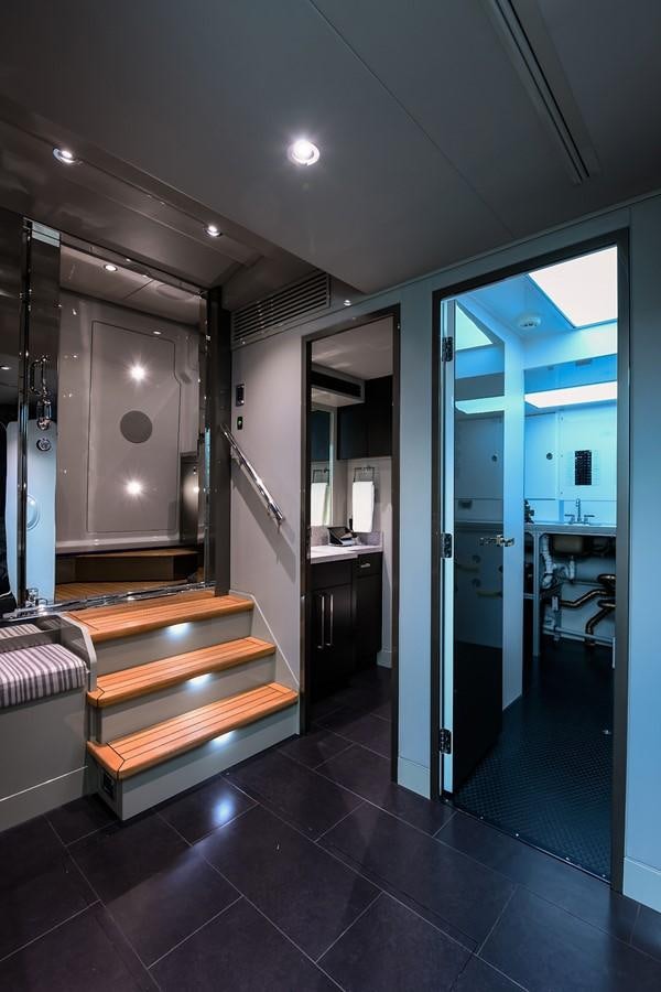 a bathroom with a large mirror aboard PEPPER XIII Yacht for Sale