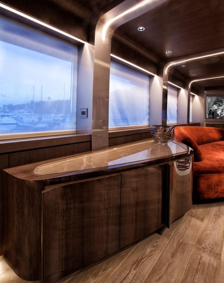 a room with a table and a window aboard PEPPER XIII Yacht for Sale