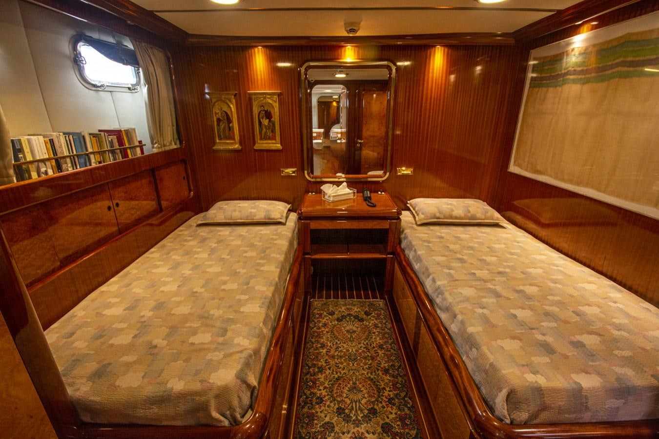 a room with a couple of beds aboard ELECTA Yacht for Sale
