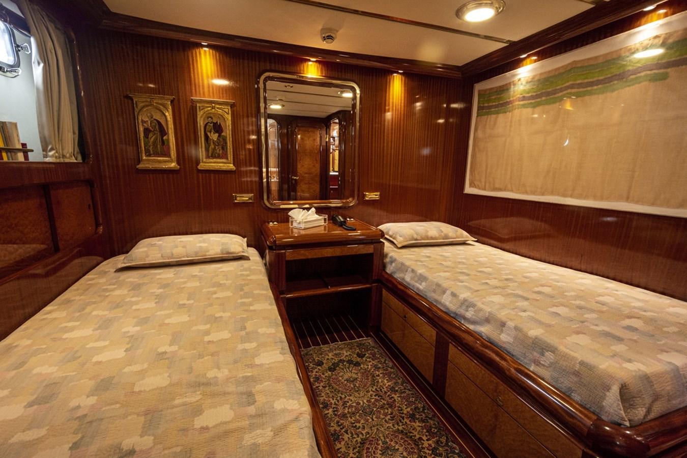 a couple of beds in a hotel room aboard ELECTA Yacht for Sale