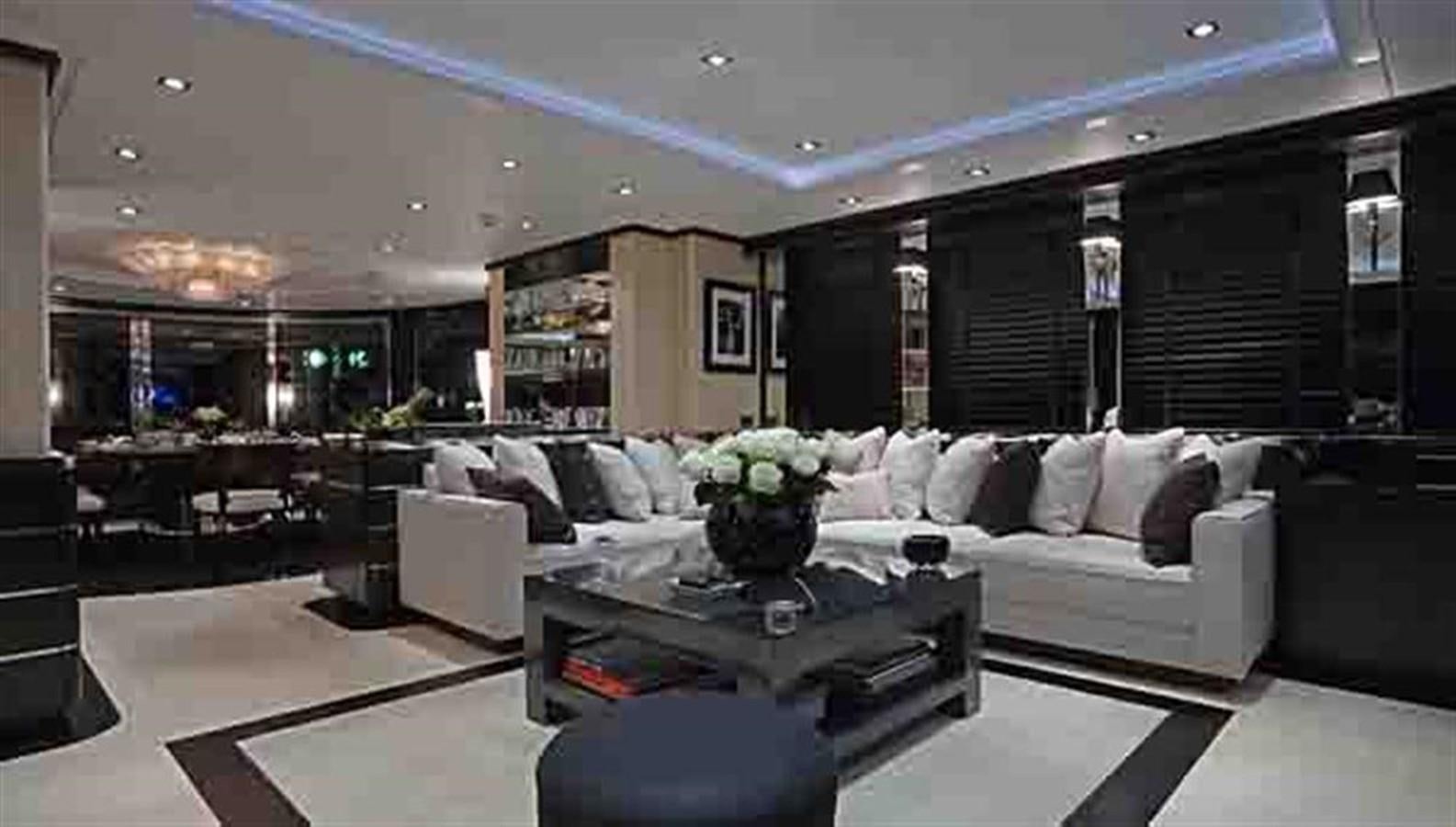 a living room with a couch and a coffee table aboard G-FORCE Yacht for Sale