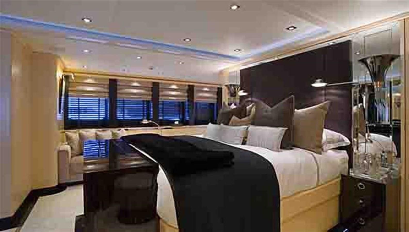 a room with a bed and a desk aboard G-FORCE Yacht for Sale