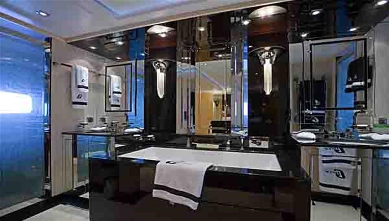 a room with a table and chairs aboard G-FORCE Yacht for Sale