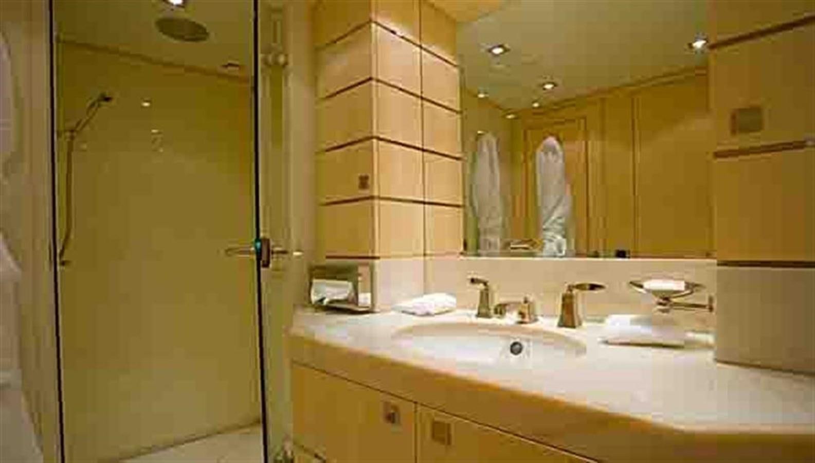 a bathroom with a sink and a mirror aboard G-FORCE Yacht for Sale