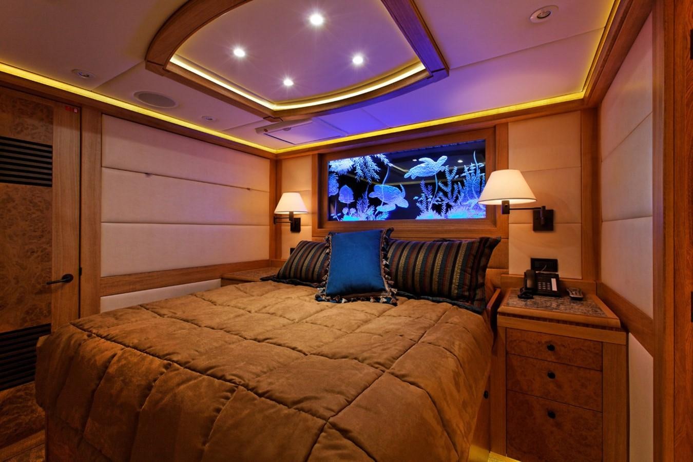 a bed with a large bed aboard ATLANTIS Yacht for Sale