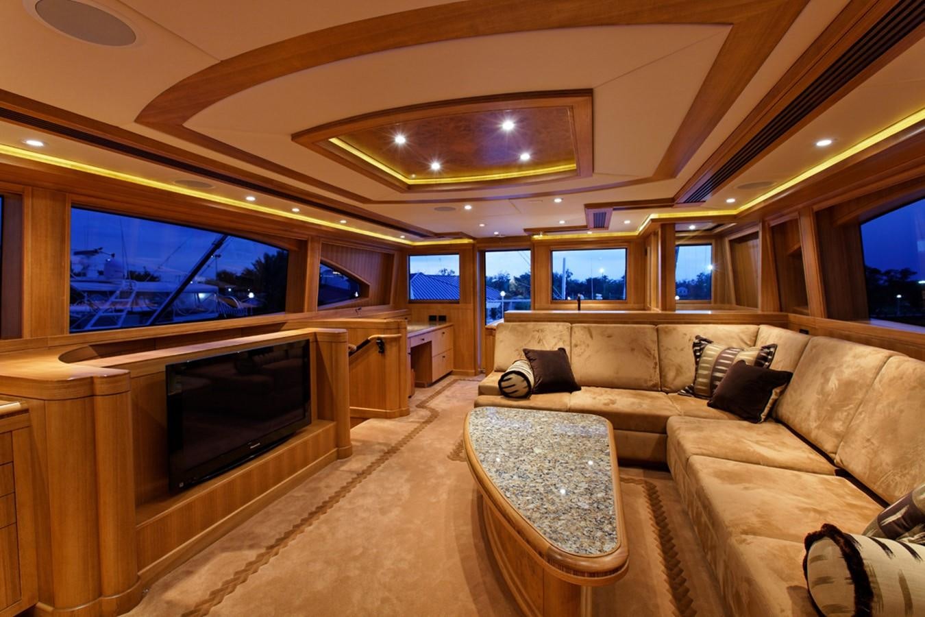 a living room with a large television aboard ATLANTIS Yacht for Sale