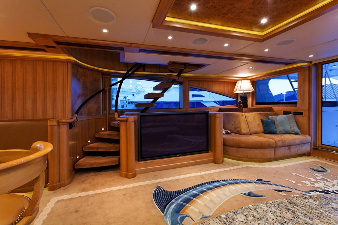 a living room with a fireplace aboard ATLANTIS Yacht for Sale