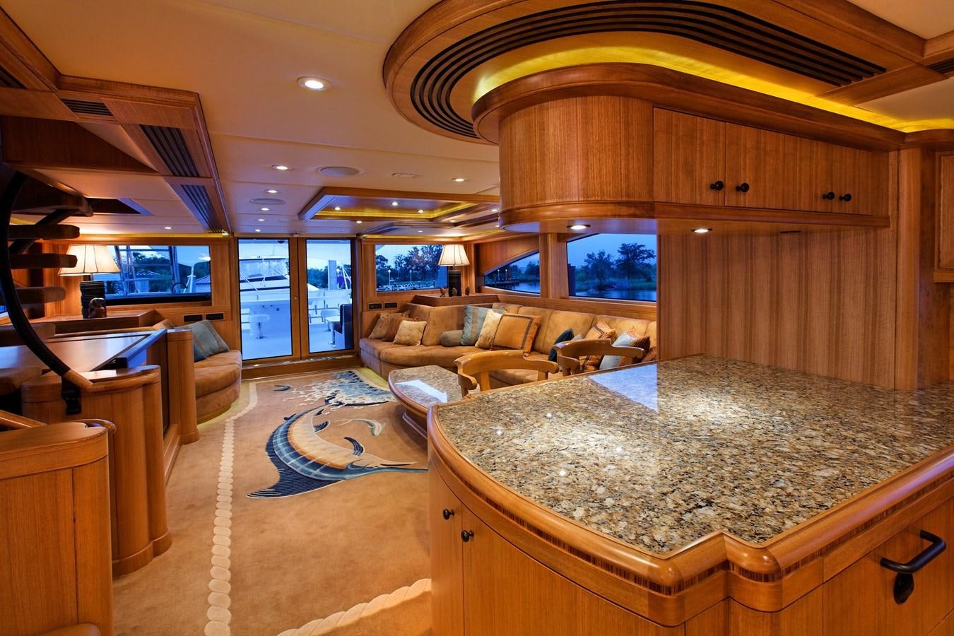 a living room with a large marble table aboard ATLANTIS Yacht for Sale