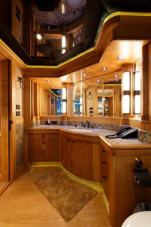 a bathroom with a large mirror aboard ATLANTIS Yacht for Sale