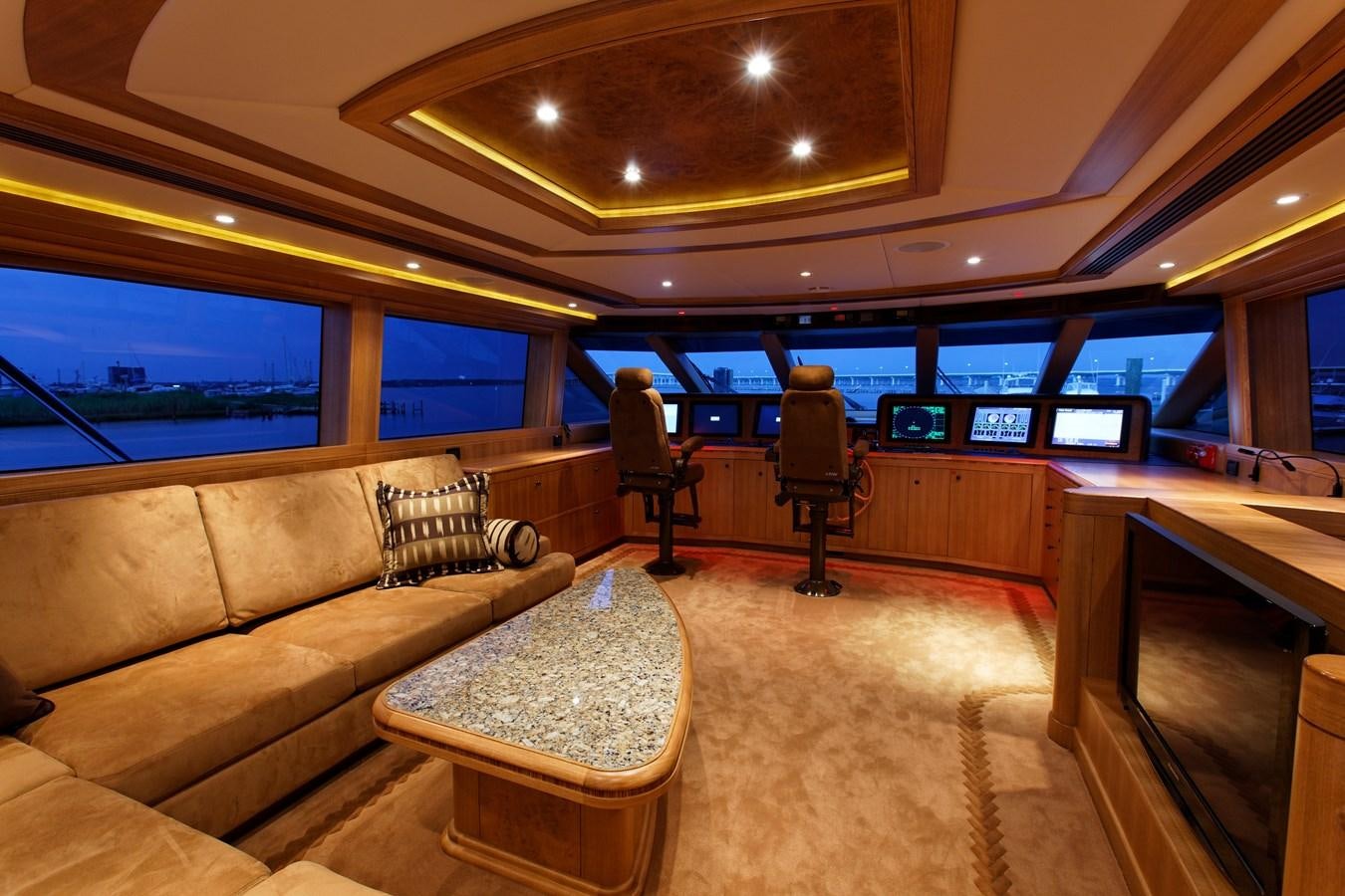 a room with a couch and a table and chairs aboard ATLANTIS Yacht for Sale
