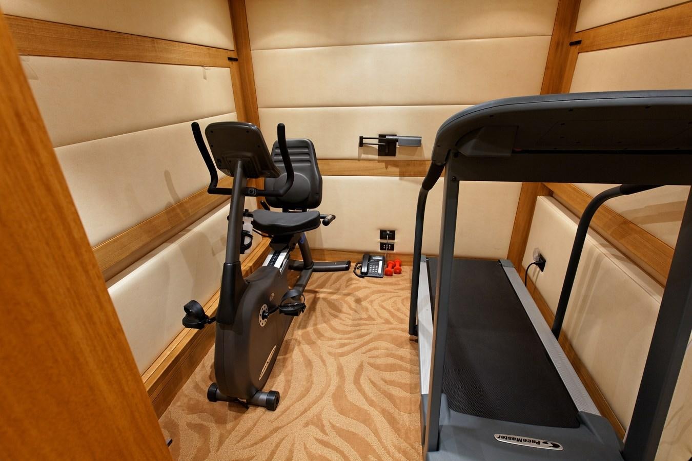 a treadmill in a room aboard ATLANTIS Yacht for Sale