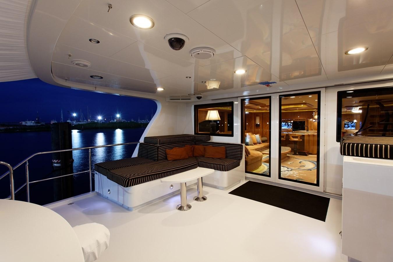 a large room with a couch and a pool aboard ATLANTIS Yacht for Sale