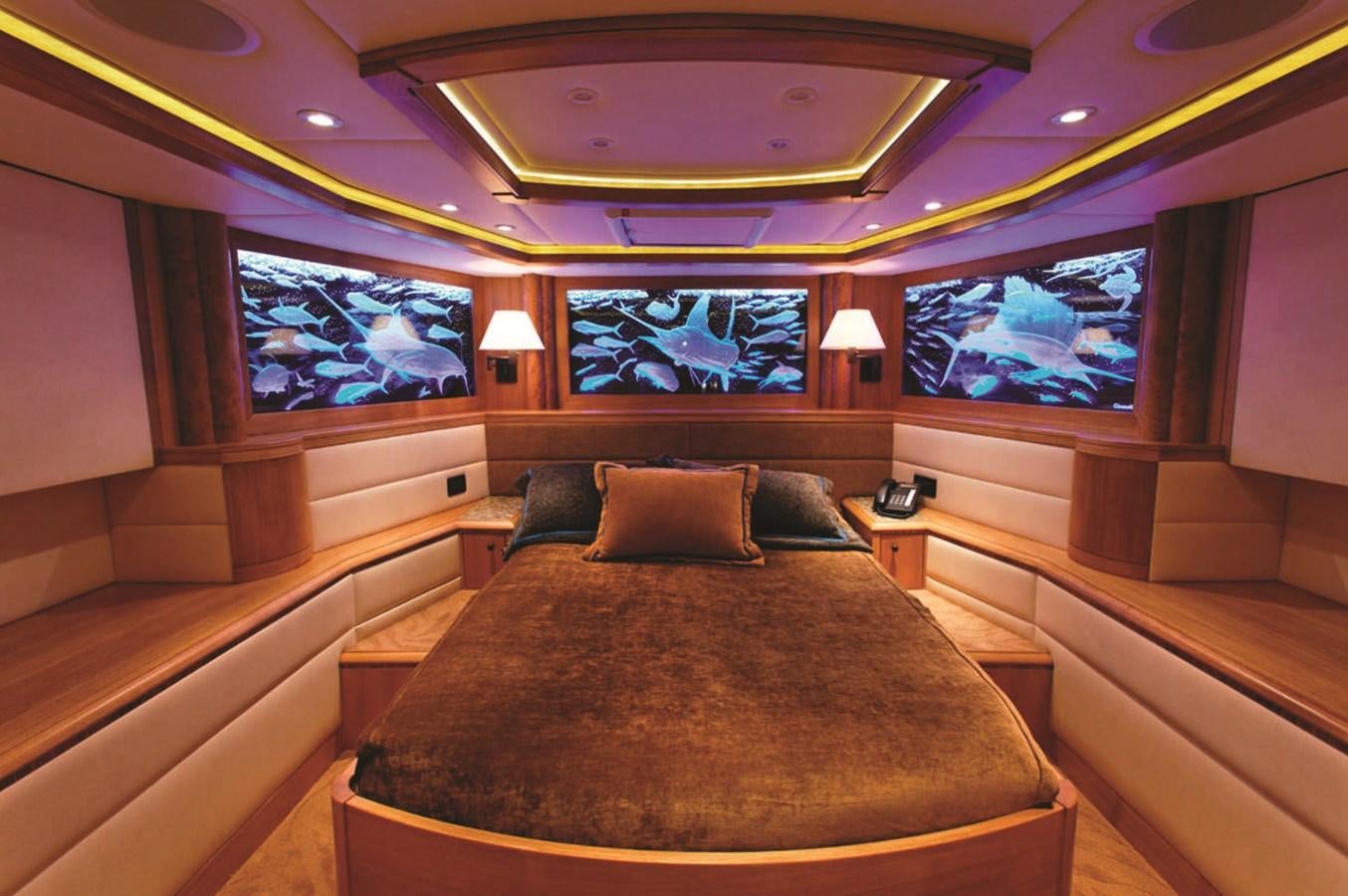 a room with a bed and a window aboard ATLANTIS Yacht for Sale