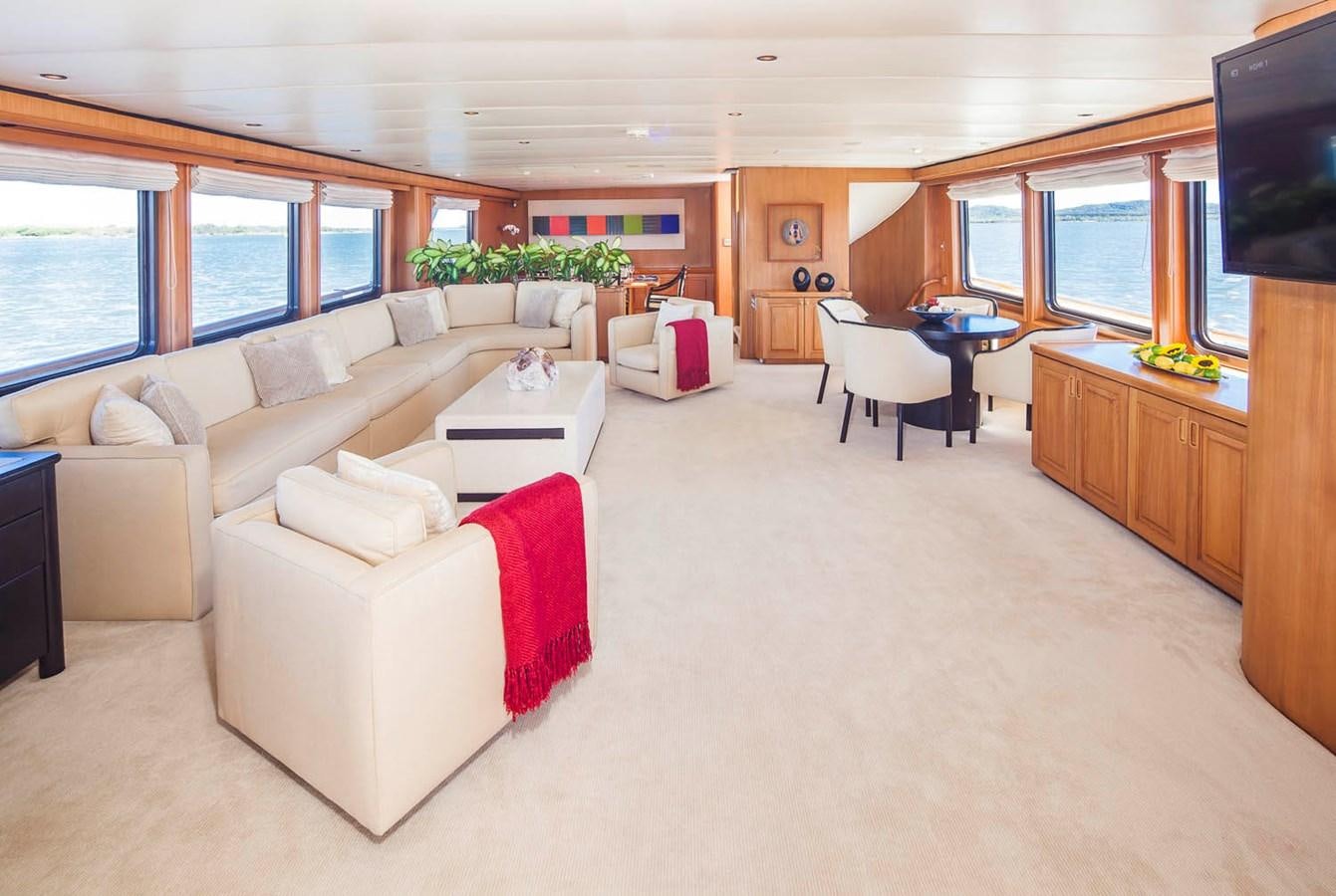 a living room with a couch and a table aboard SILENT WORLD II Yacht for Sale