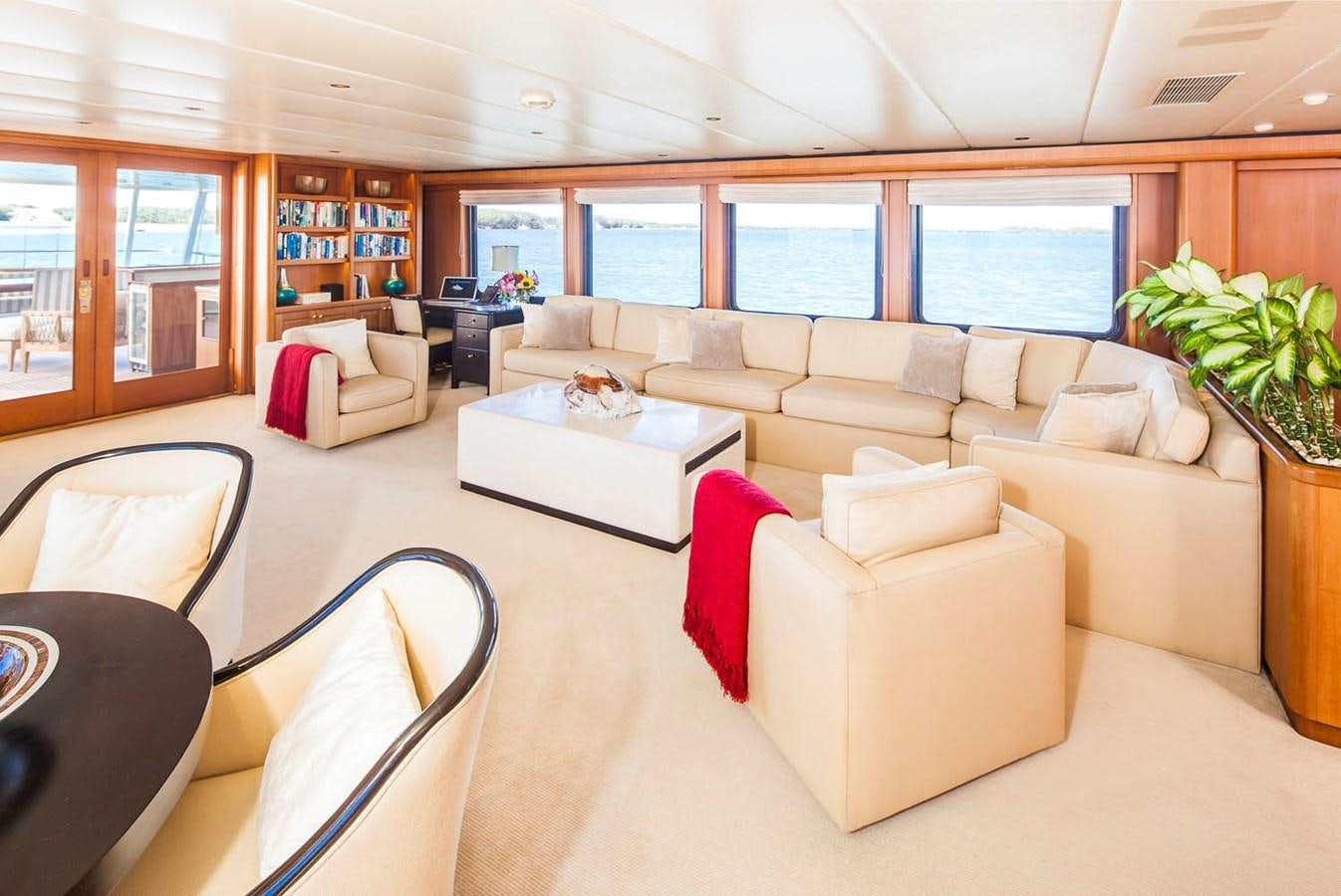 a living room with a couch and a table aboard SILENT WORLD II Yacht for Sale