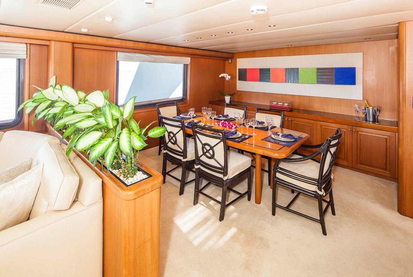 a kitchen with a table and chairs aboard SILENT WORLD II Yacht for Sale