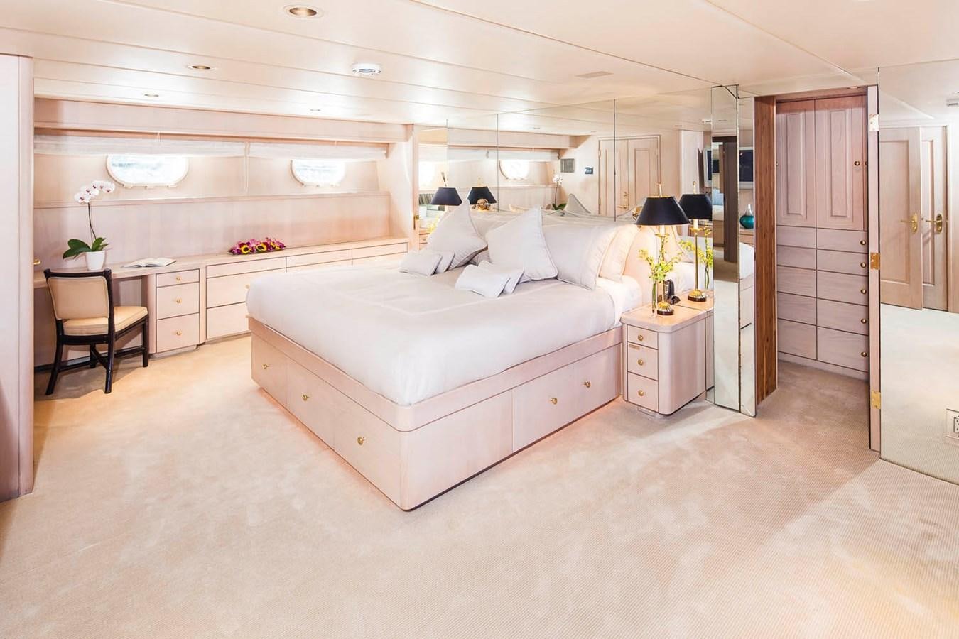 a large white bed in a room aboard SILENT WORLD II Yacht for Sale