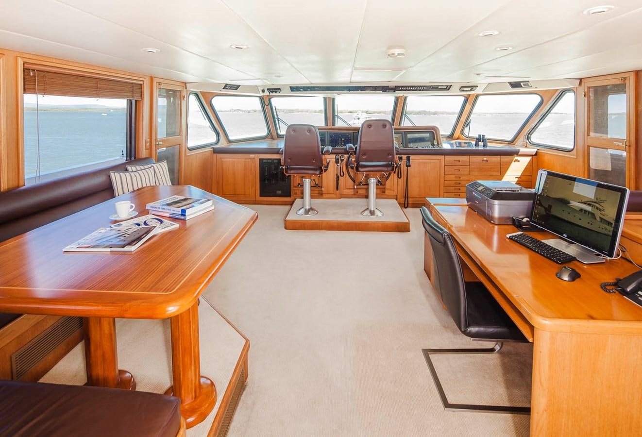 an office with a desk and computer aboard SILENT WORLD II Yacht for Sale