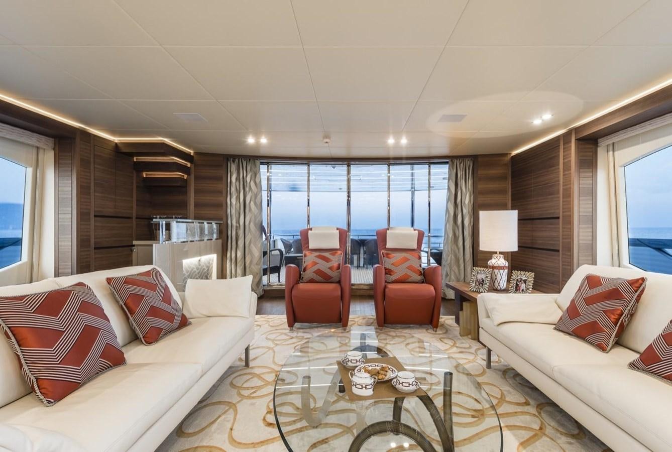 a living room with a large window aboard HARMONY Yacht for Sale