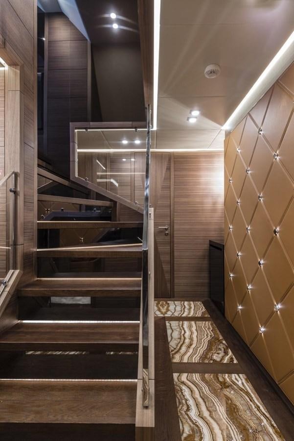 a wooden staircase with wooden walls aboard HARMONY Yacht for Sale