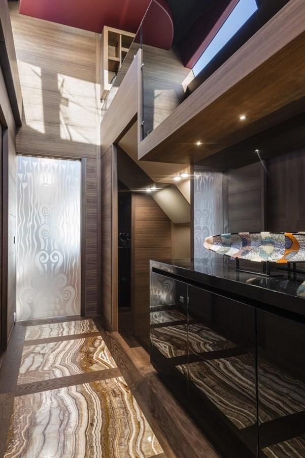 a room with a table and a mirror aboard HARMONY Yacht for Sale