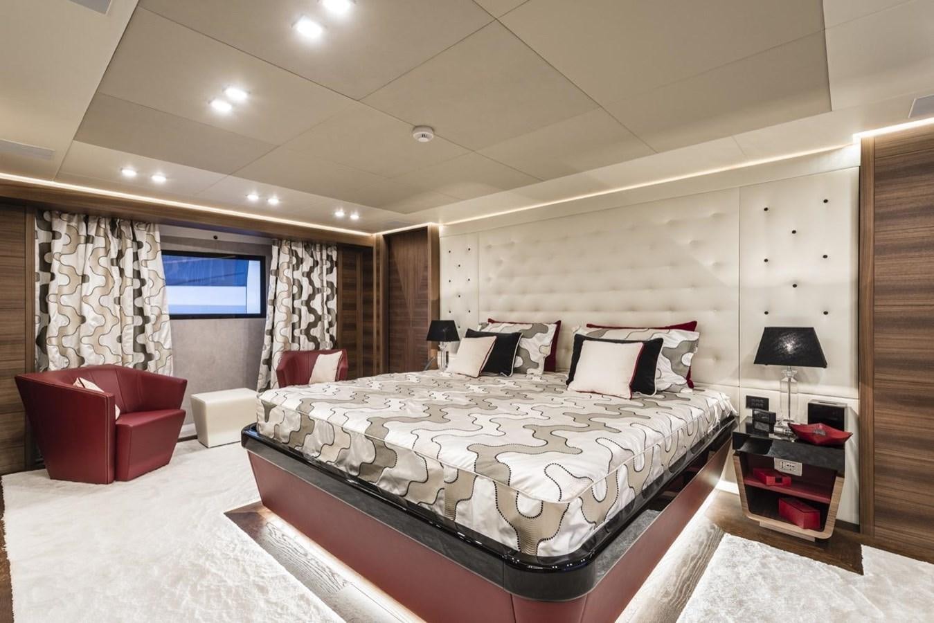 a large bedroom with a large bed aboard HARMONY Yacht for Sale