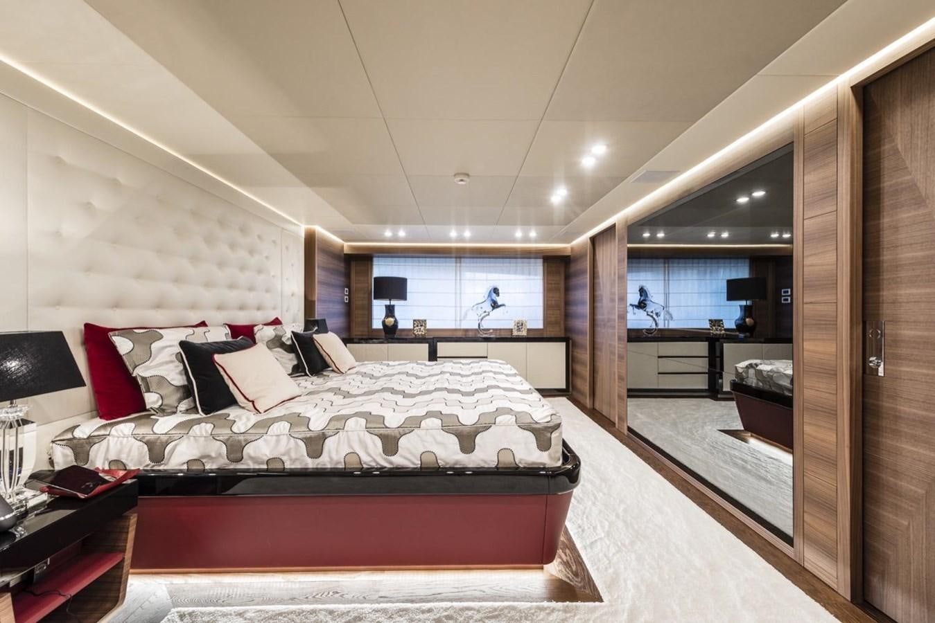 a large bedroom with a large bed aboard HARMONY Yacht for Sale