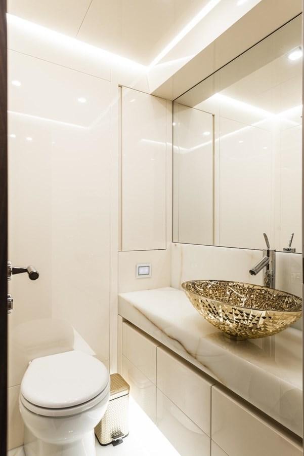 a bathroom with a sink toilet and a bathtub aboard HARMONY Yacht for Sale