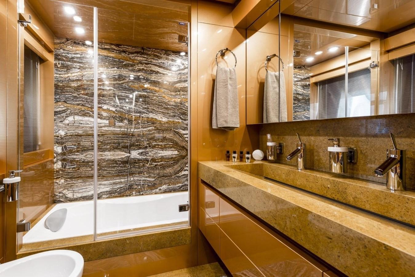 a bathroom with a large mirror aboard HARMONY Yacht for Sale
