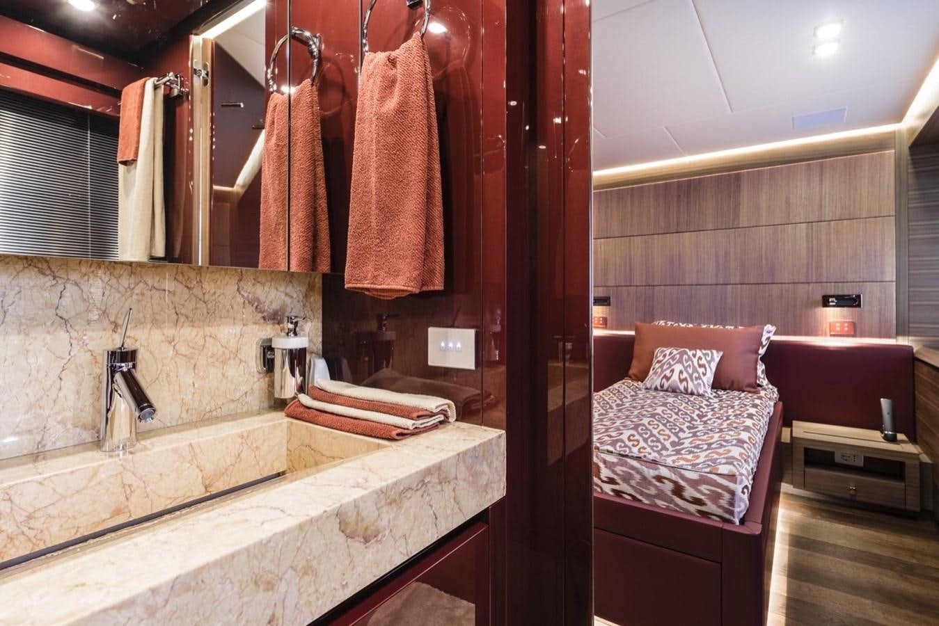 a bathroom with a bed and a bathtub aboard HARMONY Yacht for Sale