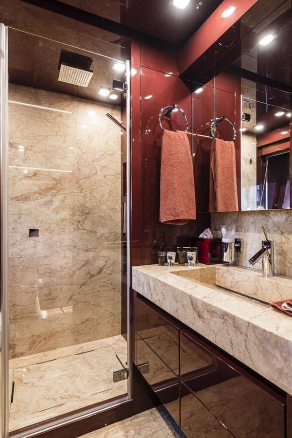 a bathroom with a shower and sink aboard HARMONY Yacht for Sale