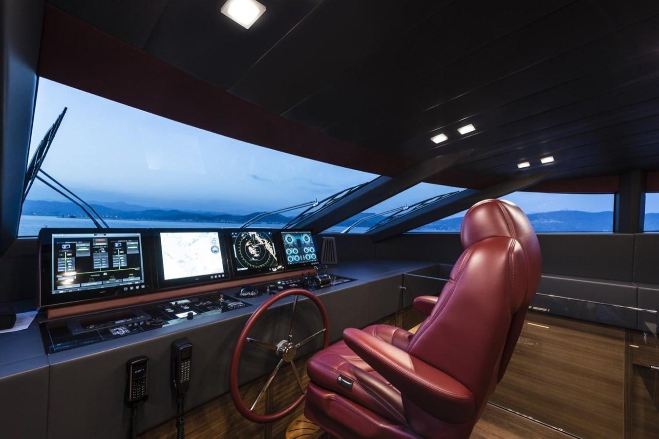 a person sitting in a chair in front of a computer aboard HARMONY Yacht for Sale