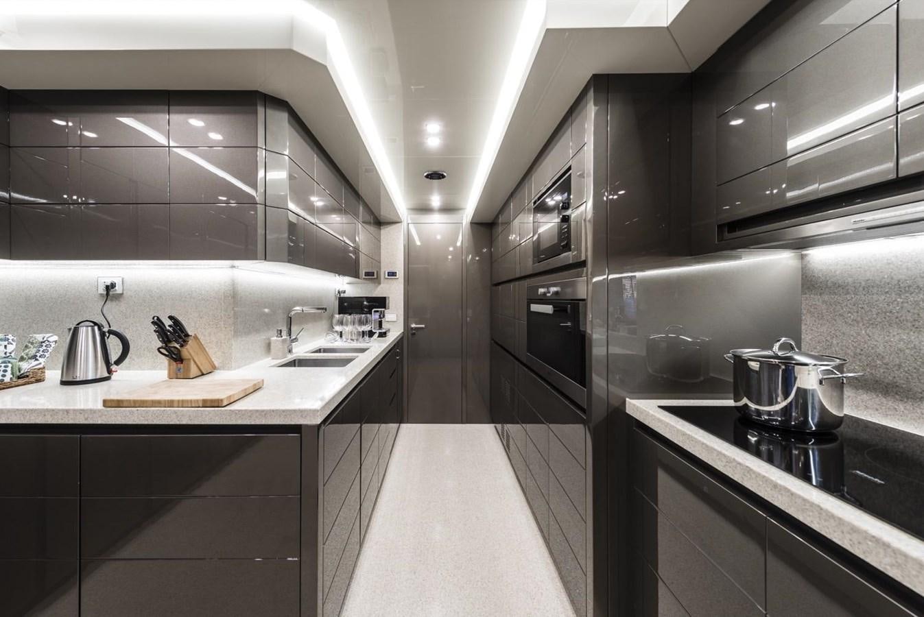a kitchen with a sink and stove aboard HARMONY Yacht for Sale