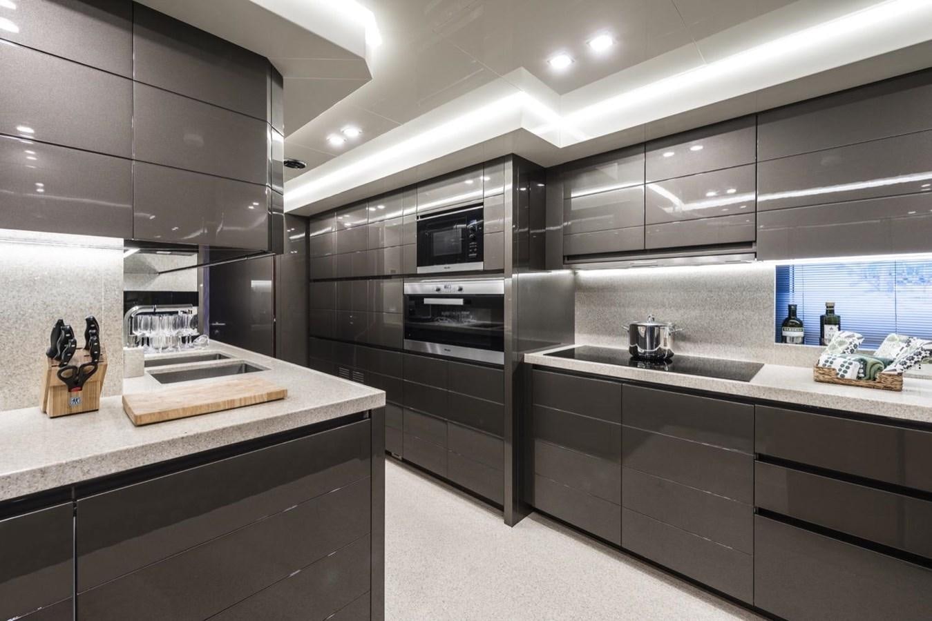 a kitchen with a large island aboard HARMONY Yacht for Sale