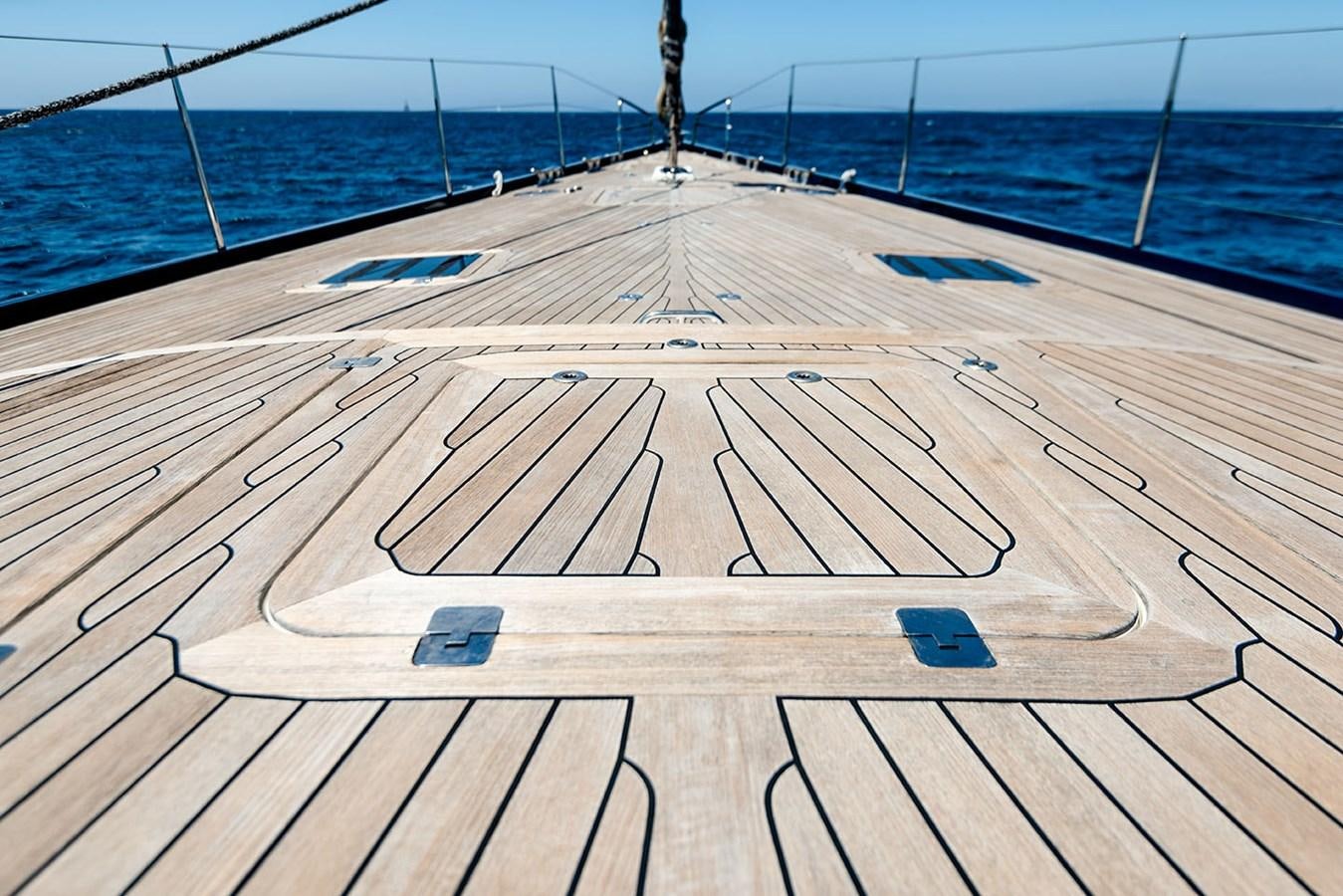 a wooden dock on a beach aboard LA VICTORIA Yacht for Sale