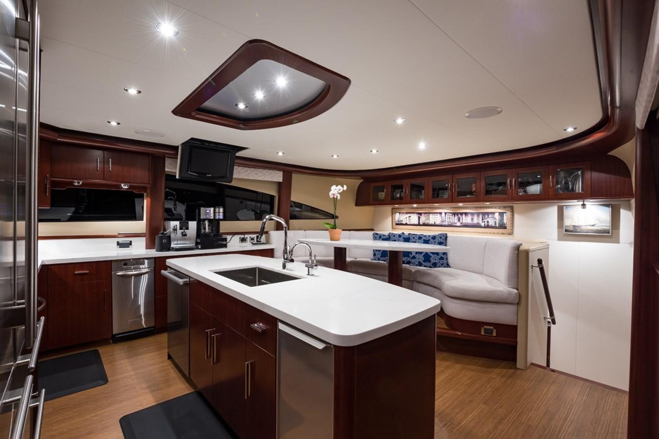 a kitchen with a large island aboard MONEY FOR NOTHING Yacht for Sale