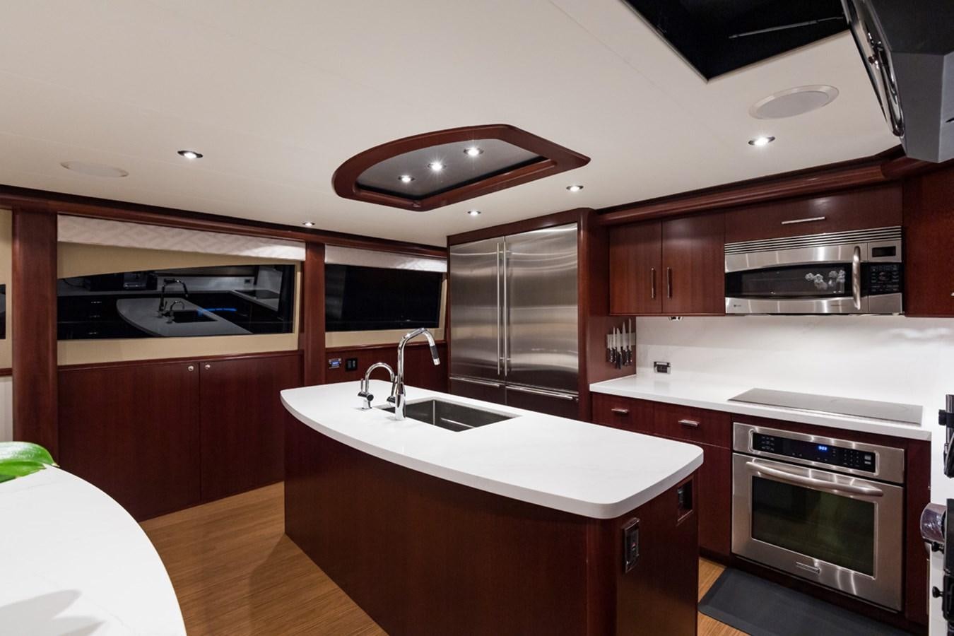 a kitchen with a stove and oven aboard MONEY FOR NOTHING Yacht for Sale