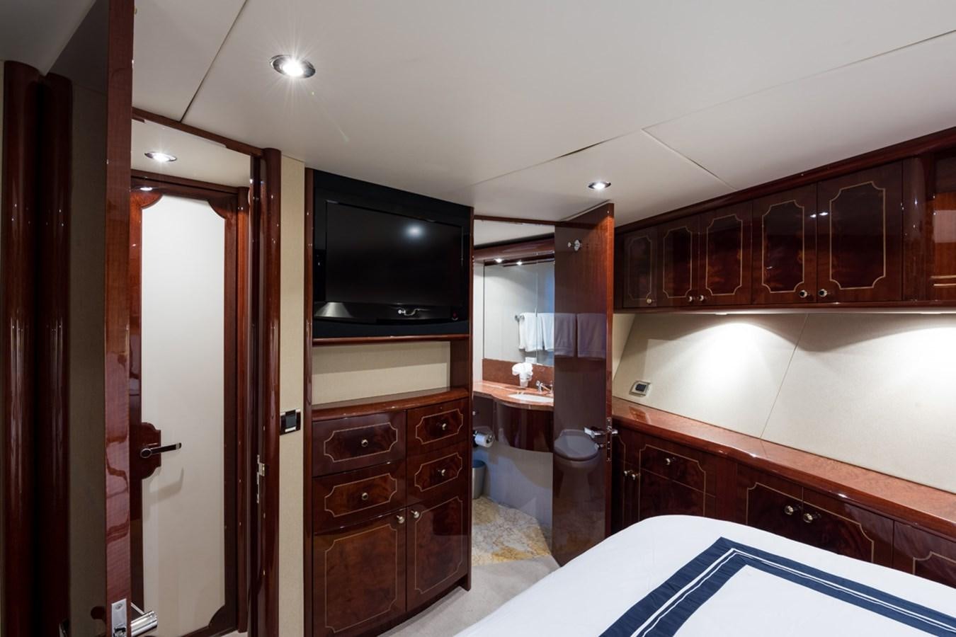 a kitchen with wooden cabinets aboard MONEY FOR NOTHING Yacht for Sale