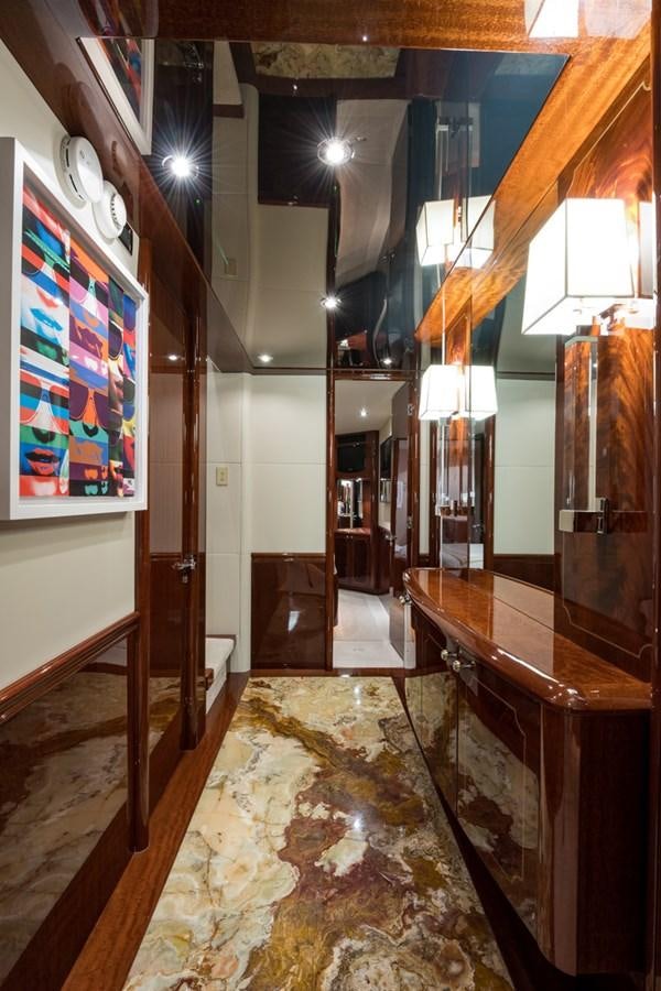 a room with a table and a mirror aboard MONEY FOR NOTHING Yacht for Sale