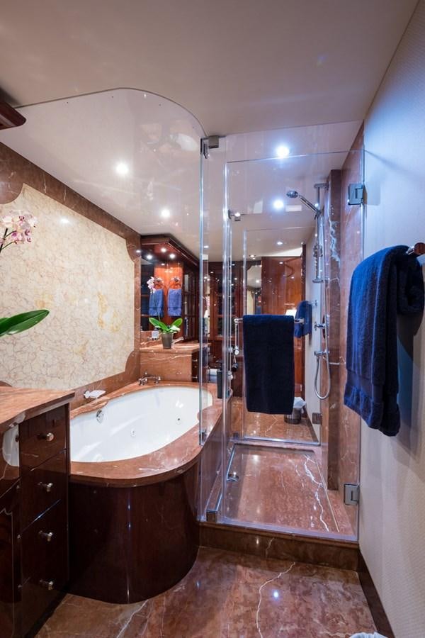 a bathroom with a sink and a shower aboard MONEY FOR NOTHING Yacht for Sale
