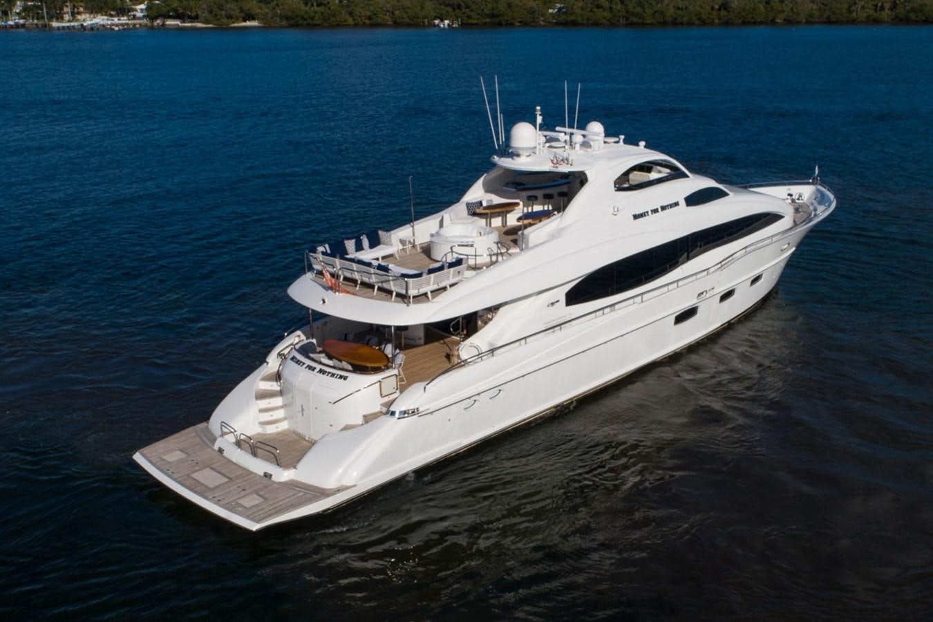 a white yacht on the water aboard MONEY FOR NOTHING Yacht for Sale