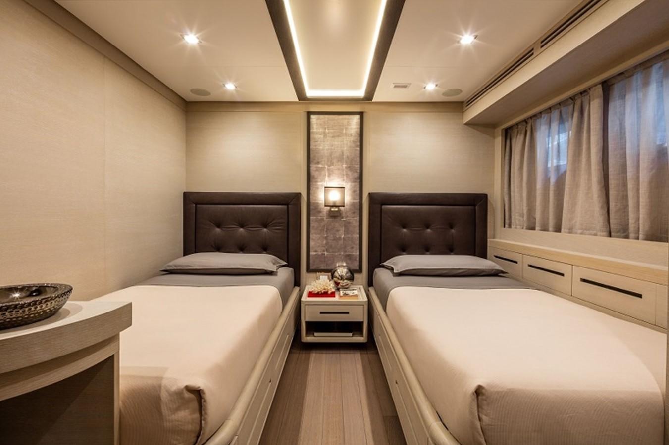 a room with three beds aboard OTAM SD35 Yacht for Sale